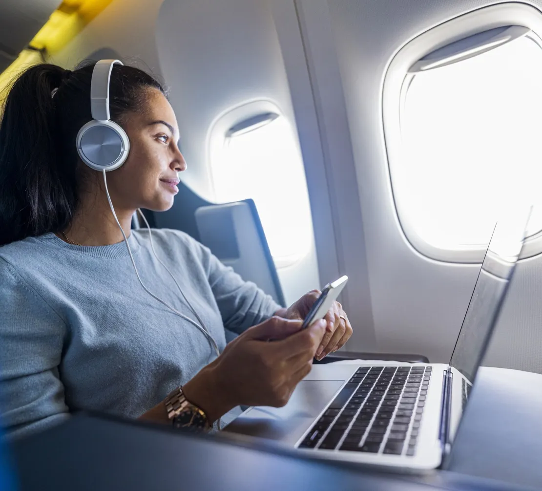 Woman On Her Laptop On A First Class Plane V2