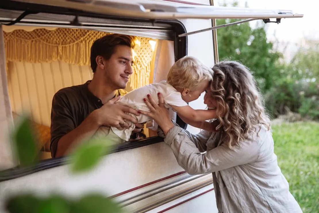 parents on holiday with young baby in a caravan