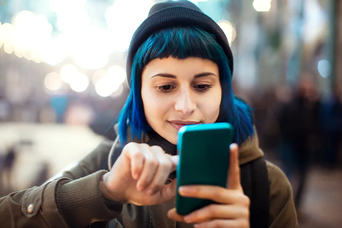Girl With Blue Hair Using Smartphone