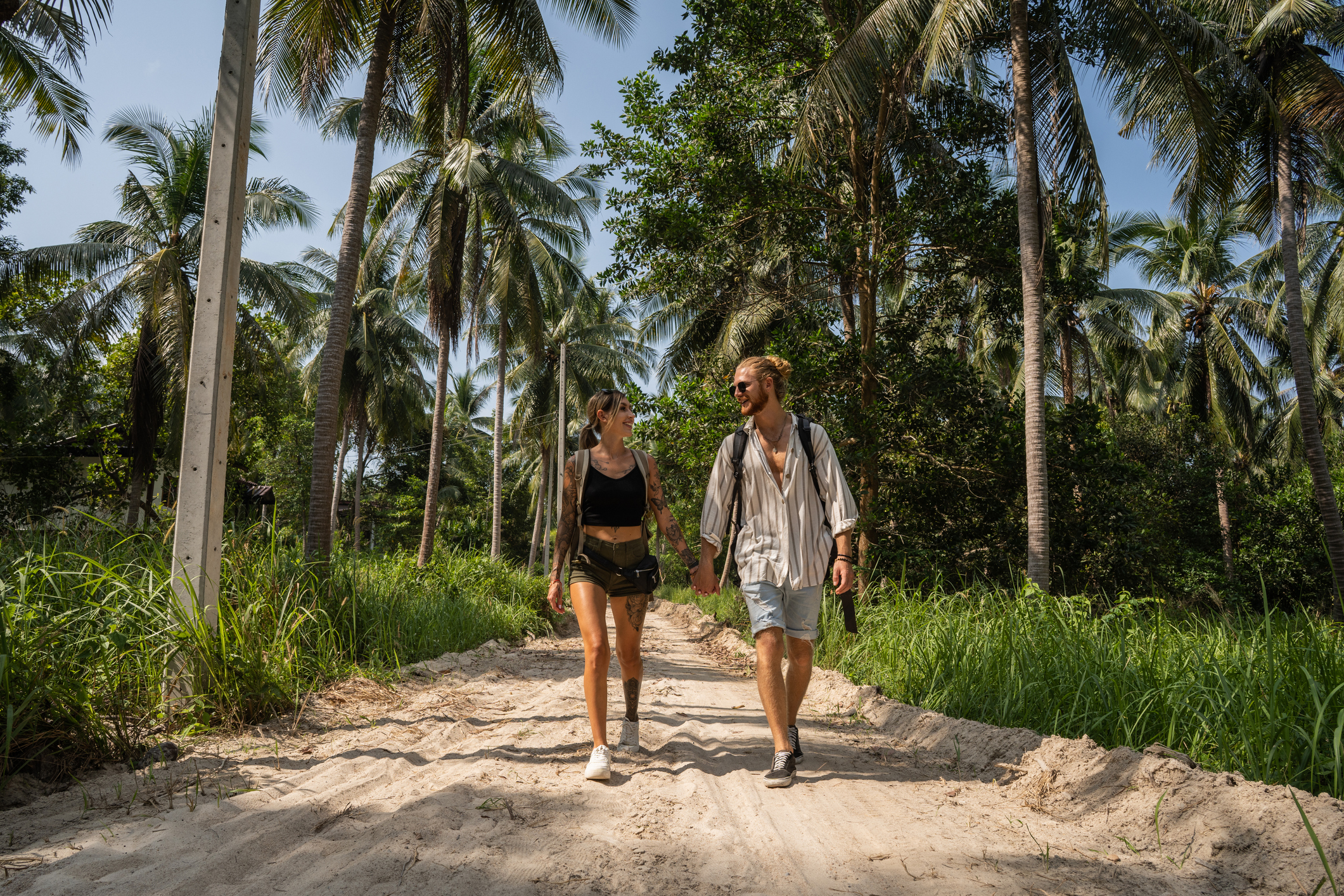 Couple Walking Through A Rainforest