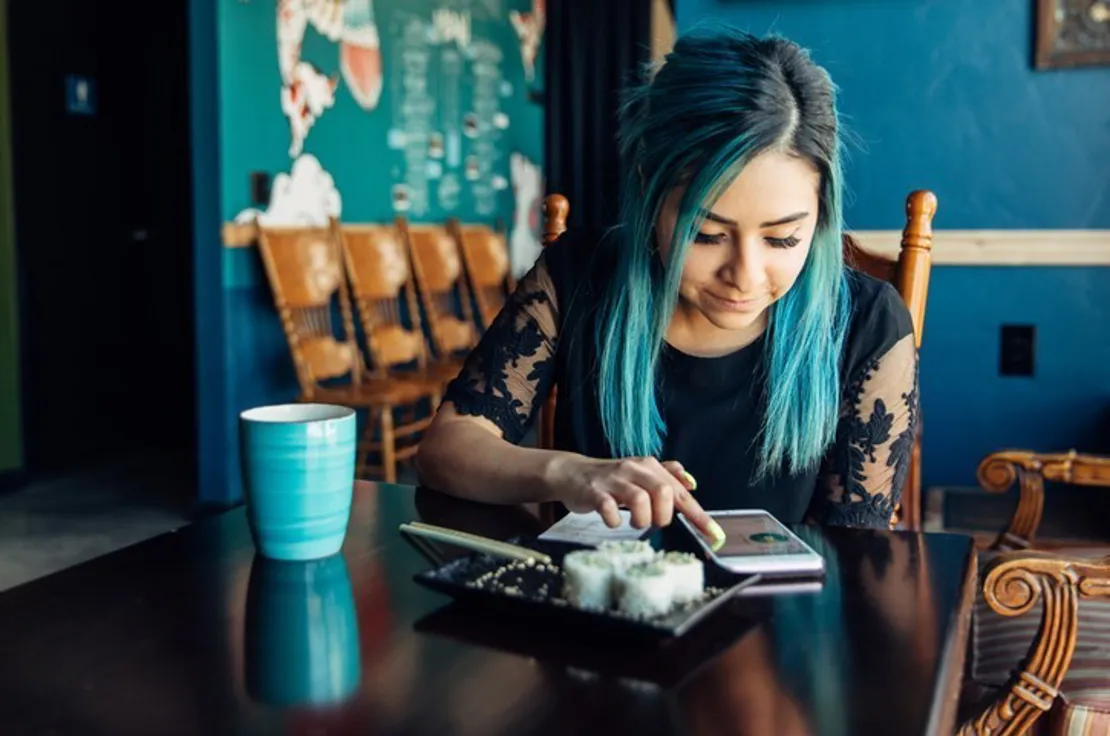 Lady Checking Finances On Mobile Phone