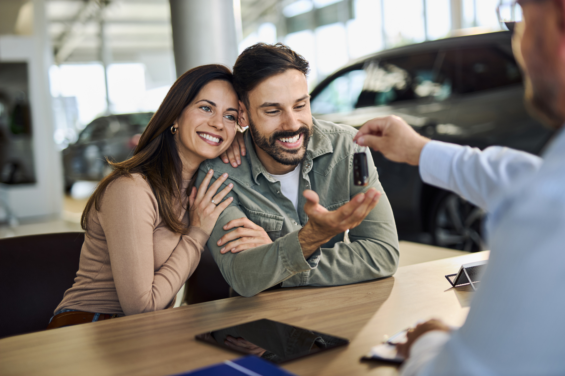 Couple buying a car based on the brand