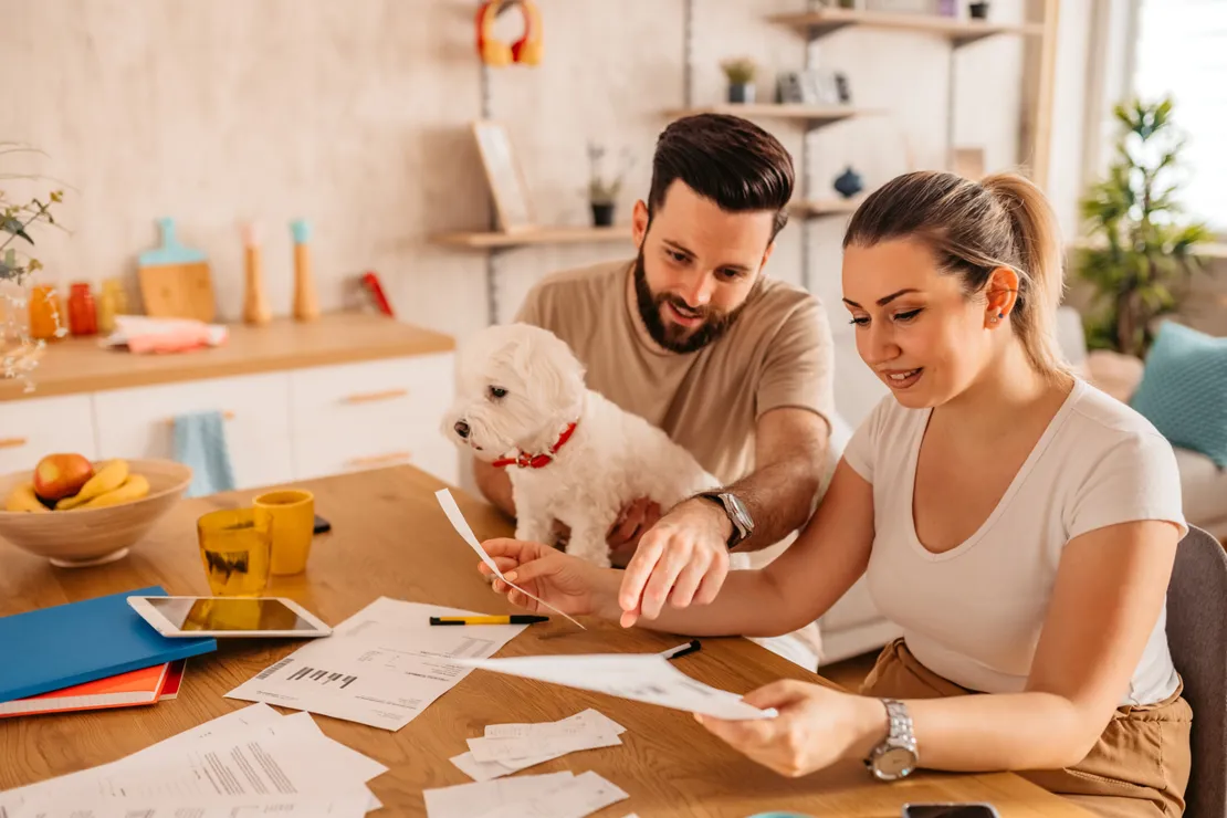 Man And Woman Reviewing Their Finances