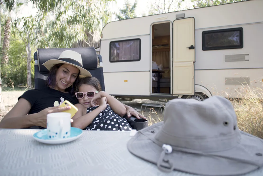Happy Family At Caravan Camping Holiday